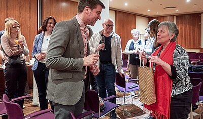 Magali Baumgartner presenting wine to IC member András Juhász