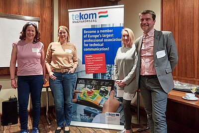 Initiative Committee members Ágnes Czinkcózki, Ildikó Feher, Boglárka Tési, András Juhász standing next to a tekom Magyarorság rollup banner