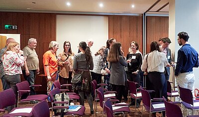 event attendees standing at the buffet and networking