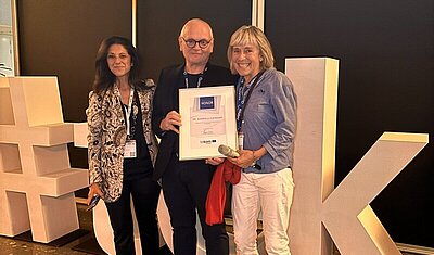 Gabriela Fleischer being honored by tekom Europe Chair and CEO