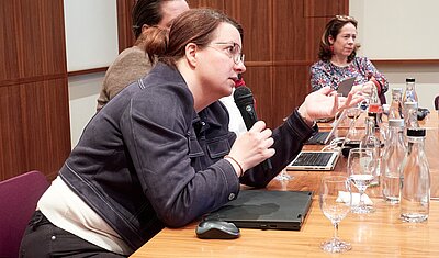 newly elected chairperson Birgit Fuhrmann in discussion with delegates