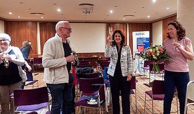 Michael Fritz and Tiziana Sicilia handing flowers to the Hungarian delegate Ágnes Czinkcózki